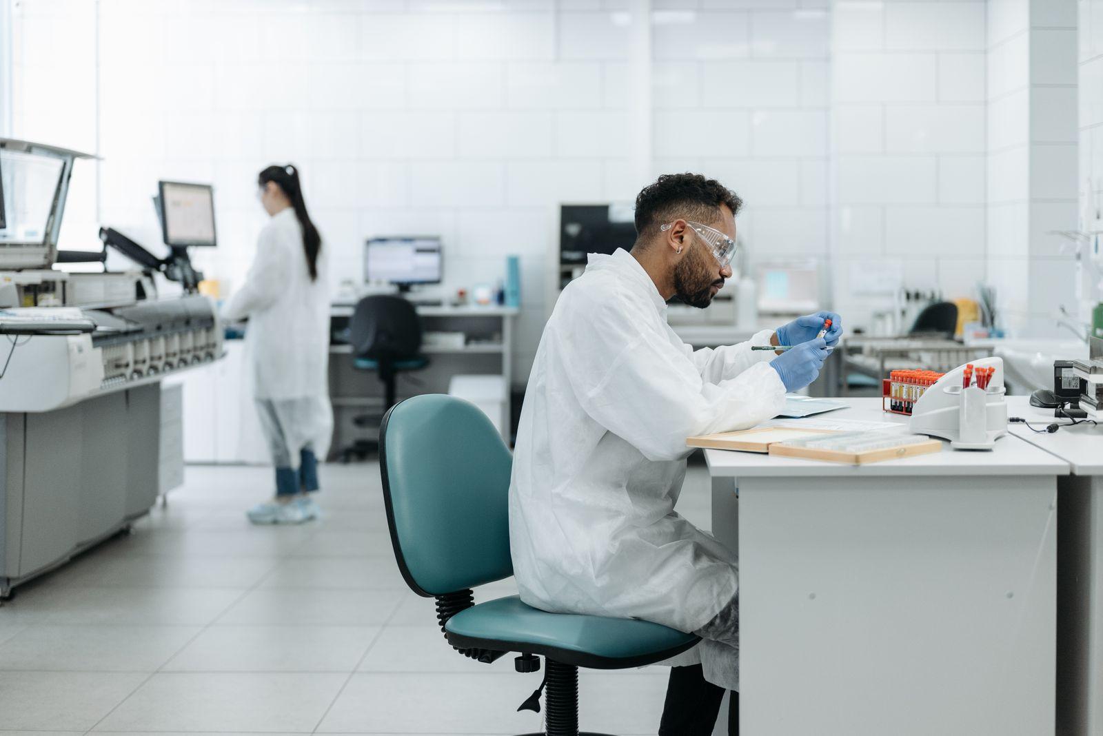 Researchers analyzing samples together in a modern laboratory